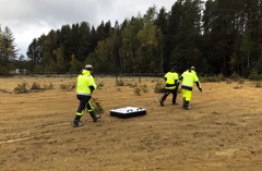 Picture shows operators dragging SGU:s ground-penetrating radar system behind them.