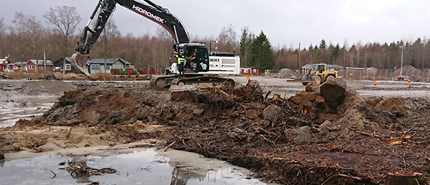 Bild på grävmaskin.